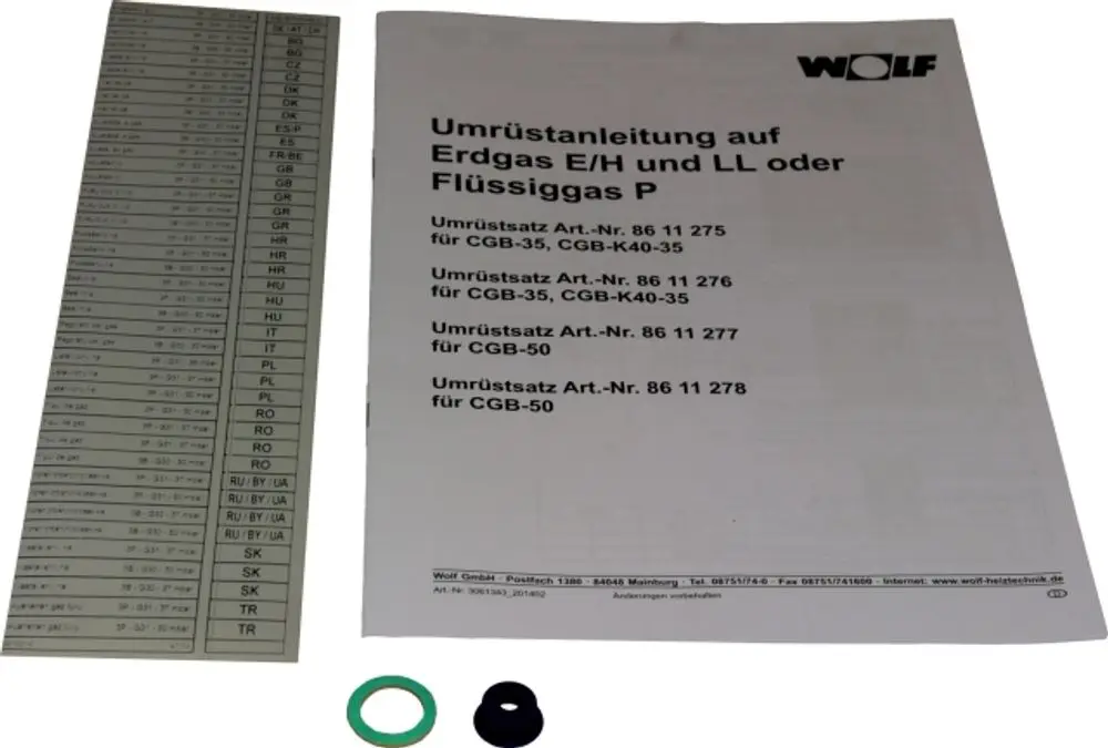 Umbausatz von Wolf für die Umrüstung auf Erdgas E/LL oder Flüssiggas, bestehend aus Anleitung, Schablone und zwei Dichtungen.